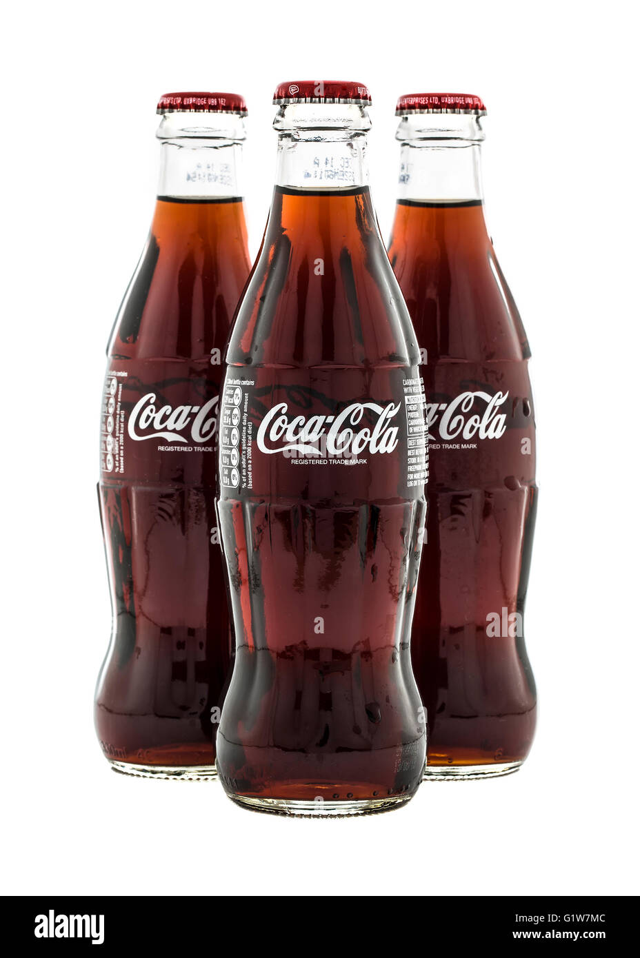 Trois bouteilles de Coca classique sur fond blanc Banque D'Images