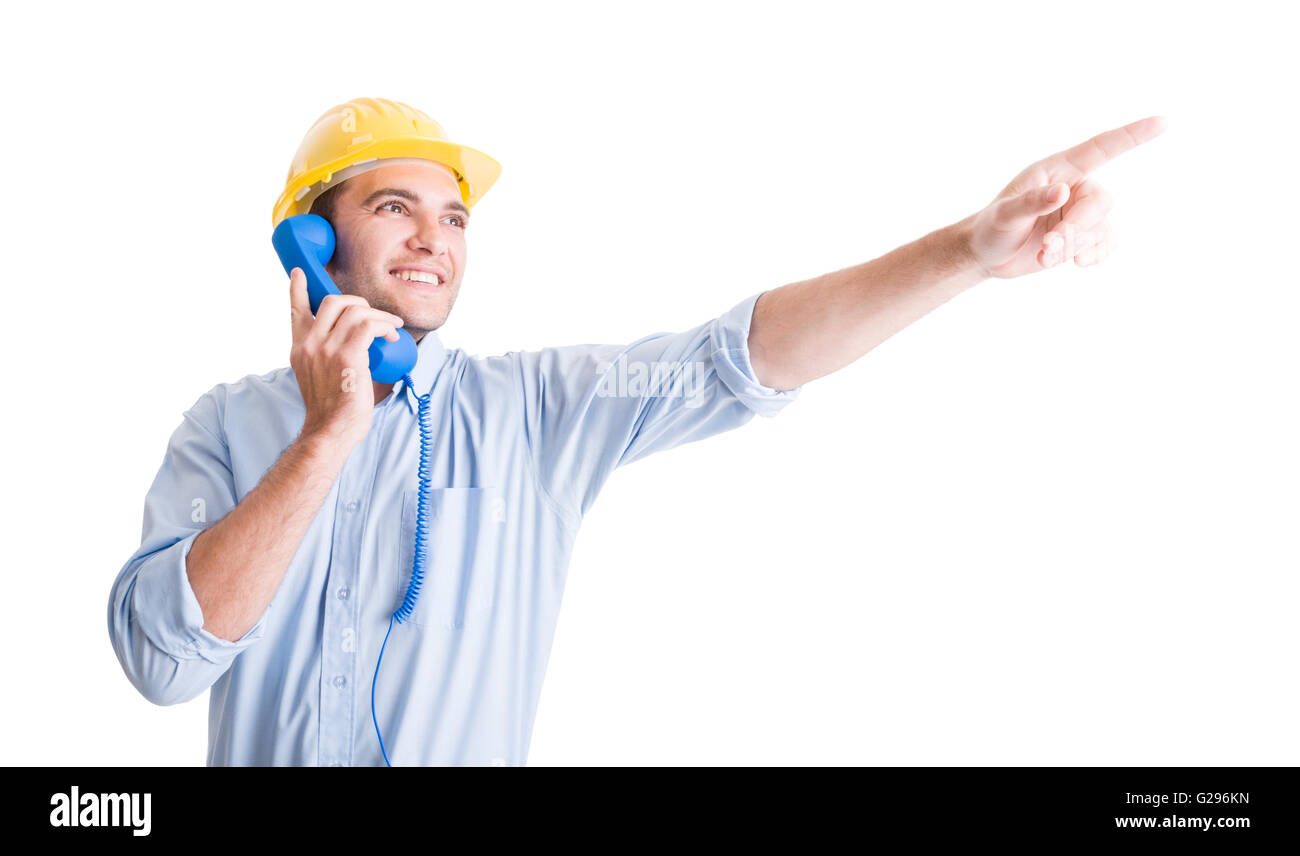 Architecte visionnaire parlant au téléphone et un doigt pointé vers le haut montrant quelque chose Banque D'Images
