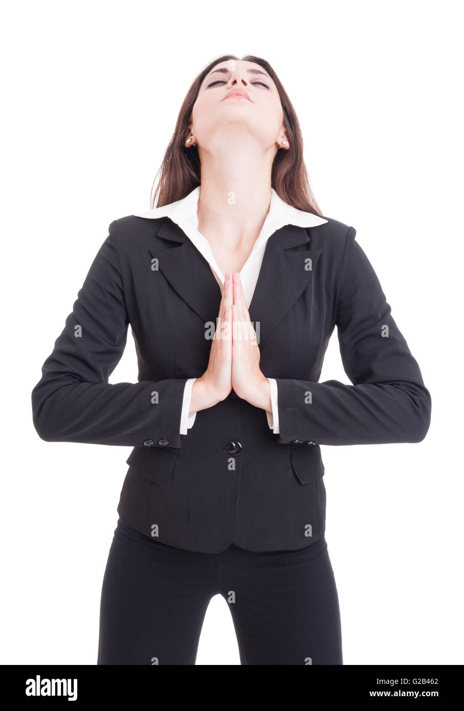 Femme d'affaires élégante de prier avec les yeux fermés et paumes ensemble isolé sur fond blanc Banque D'Images