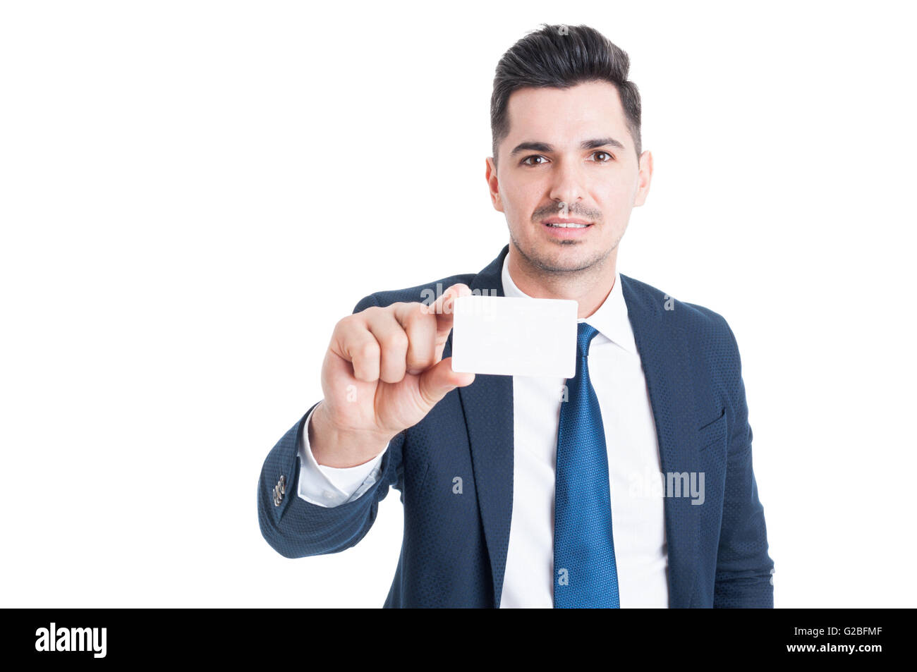 Portrait of young businessman holding sa carte blanche avec zone publicitaire isolated on white Banque D'Images