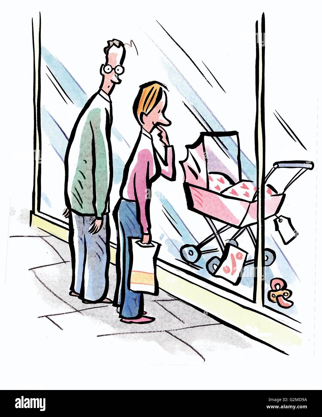 La femme et l'homme à la recherche de chariot à baby shop Banque D'Images