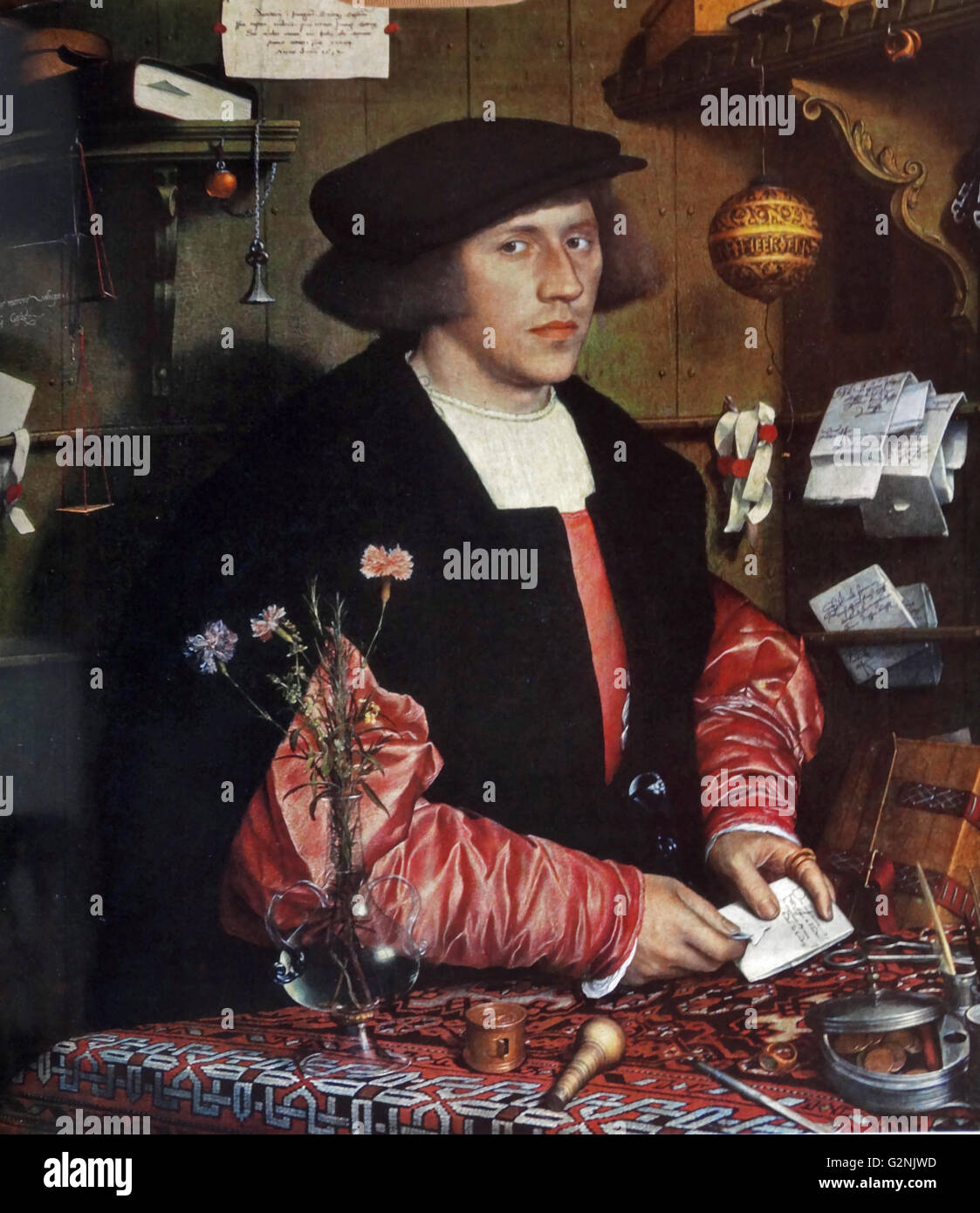 Portrait de Georg Gisze (1497-1562) une Hanse marchand. Gisze est représenté dans son bureau avec des symboles de sa richesse et de l'éducation, y compris les balances, et fioles en verre. Peint par Hans Holbein le Jeune (1497-1543) un artiste allemand et graveur. En date du 16e siècle. Banque D'Images