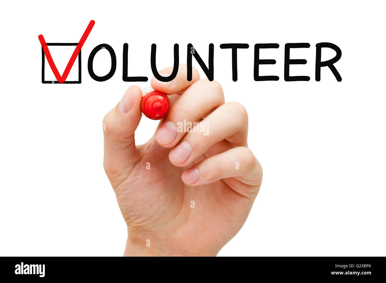 Mettre la main coche avec marqueur rouge sur la case à cocher dans le formulaire de bénévolat. Banque D'Images