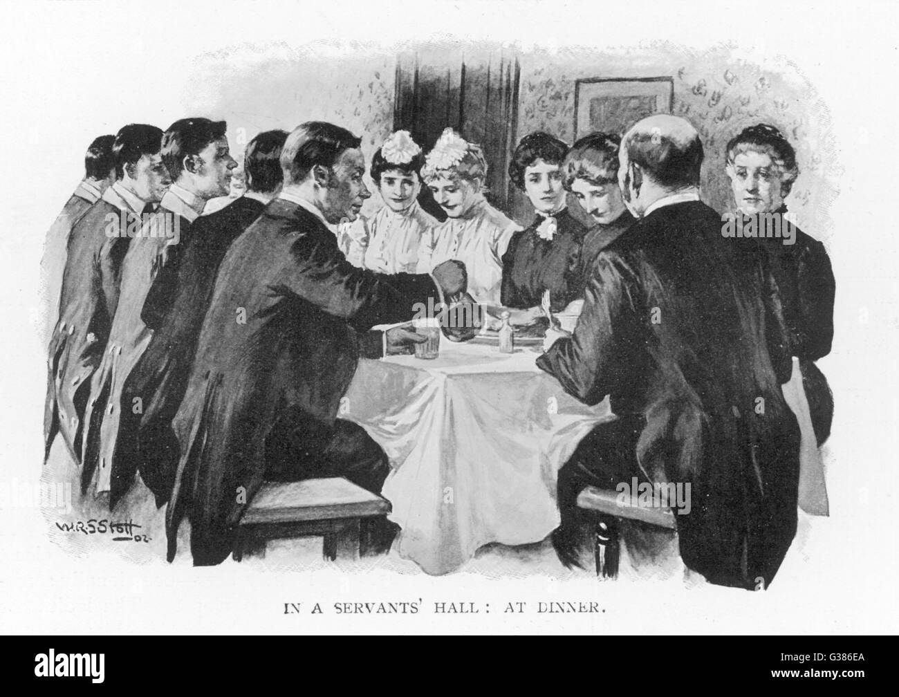 Le dîner dans le hall des fonctionnaires d'une grande maisonnée : le majordome qui préside, avec femme de ménage, femme de ménage, ménage et hommes variait en fonction de l'ancienneté Date : vers 1900 Banque D'Images