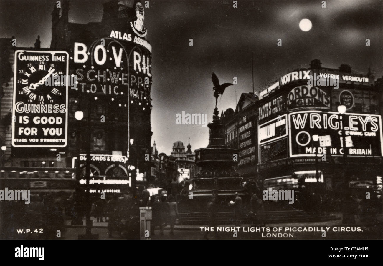 Les néons de Piccadilly Circus la nuit, Londres Date : vers 1950 Banque D'Images