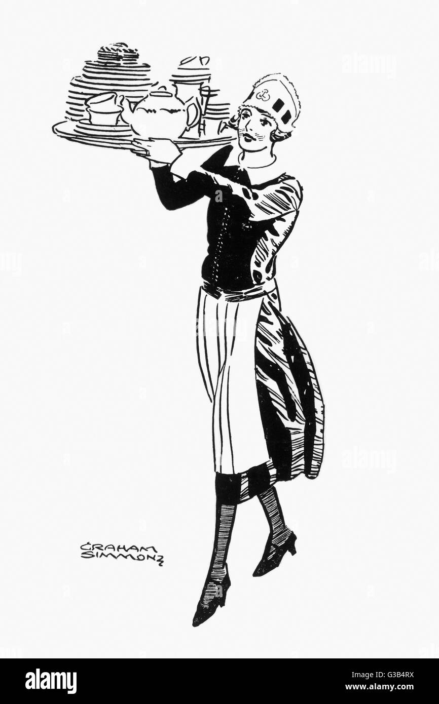 Un grand plateau s'effectue par une serveuse dans l'un de Lyon' teashops qui à l'époque ont été trouvés à travers Londres Date : vers 1935 Banque D'Images