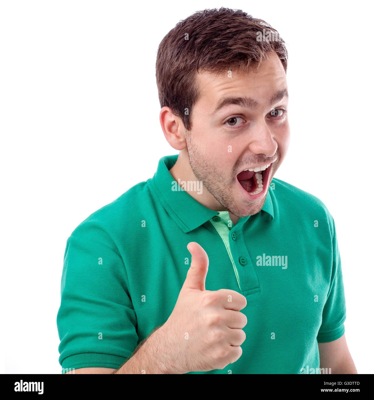 Beau jeune homme en chemise verte avec Thumbs up Banque D'Images