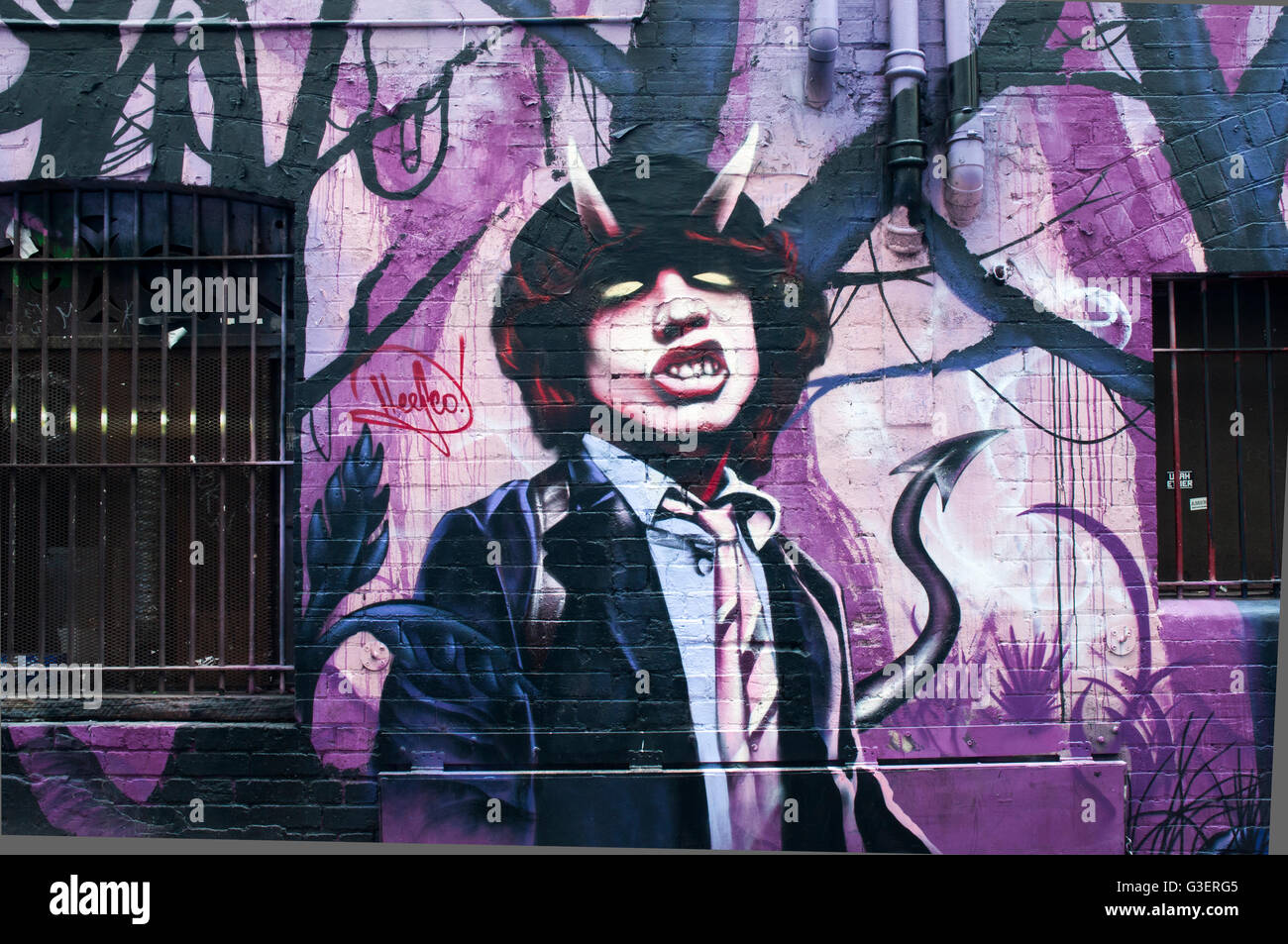 Street art murales dans AC/DC Lane, Melbourne, commémoration de la rock music band de ce nom Banque D'Images