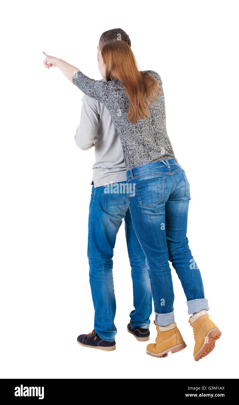 Jeune couple pointing at wal vue arrière (femme et homme Jeune couple pointing at wal vue arrière (femme et homme