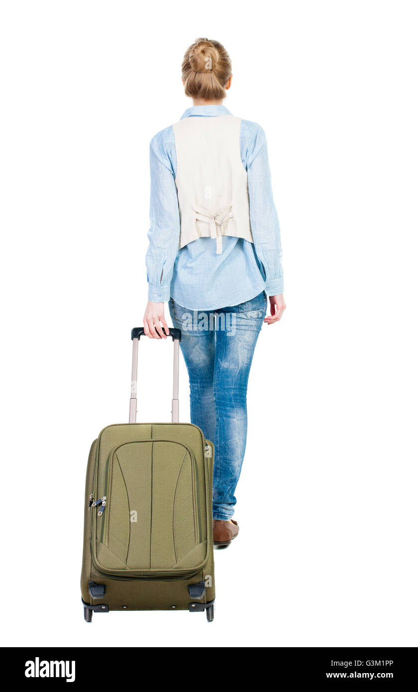Woman dragging suitcase Banque de 
