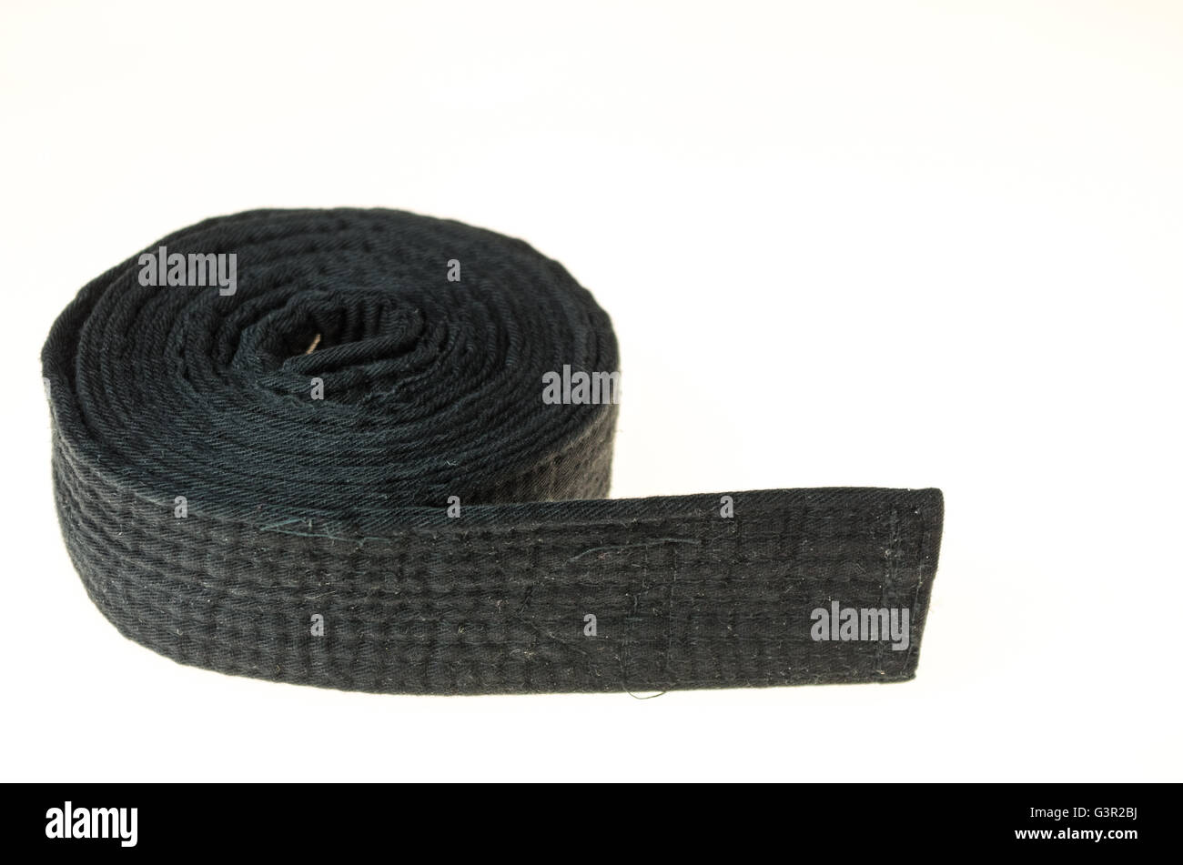 Ceinture noire d'arts martiaux isolé sur fond blanc Banque D'Images