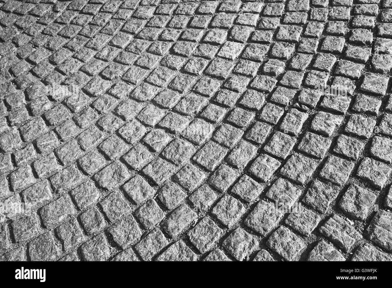 Rue pavée avec revêtement gris motif rond, texture de fond urbain Banque D'Images