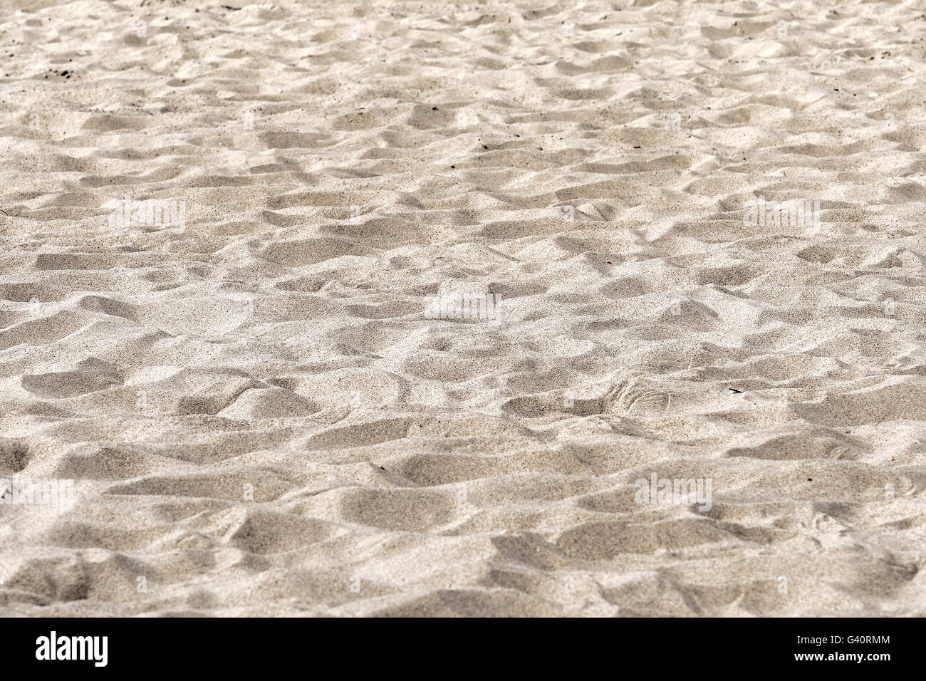 La texture du sable. Plage de sable pour le fond Banque D'Images