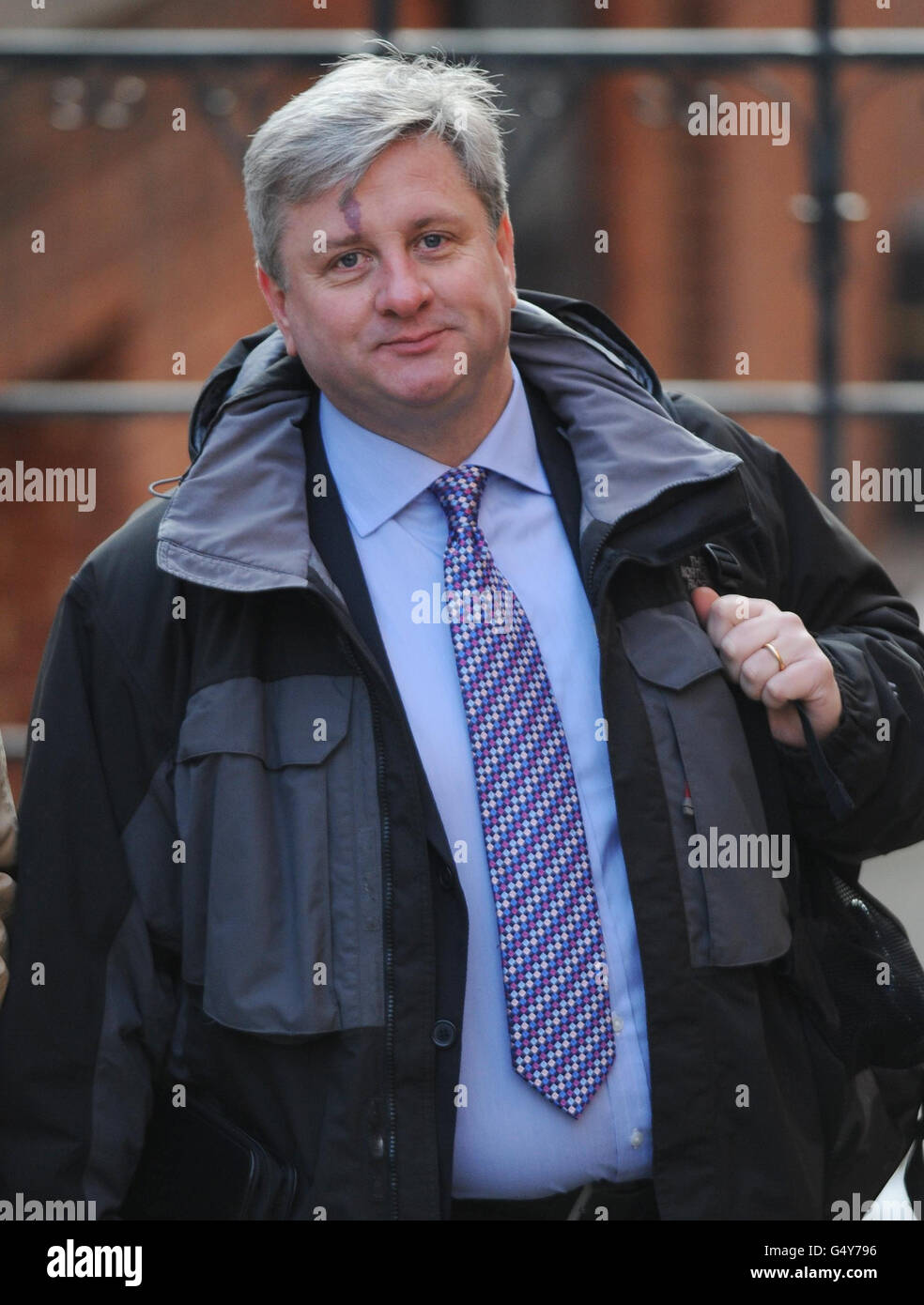 Neil Turner, vice-président de la British Press Photographerss' Association, arrive à la Leveson Inquiry sur les normes de presse à la High court de Londres. Banque D'Images