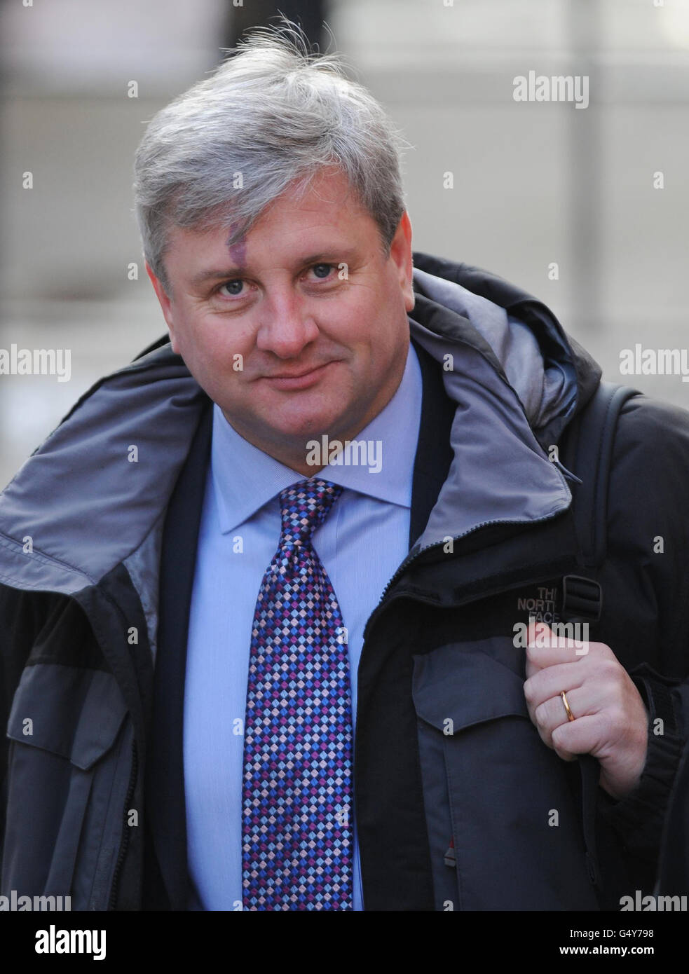 Neil Turner, vice-président de la British Press Photographerss' Association, arrive à la Leveson Inquiry sur les normes de presse à la High court de Londres. Banque D'Images