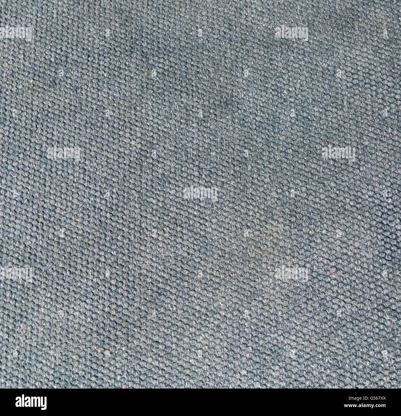 Surface du tissu avec un feutre gris avec la texture d'appuyé sur les cellules. Banque D'Images