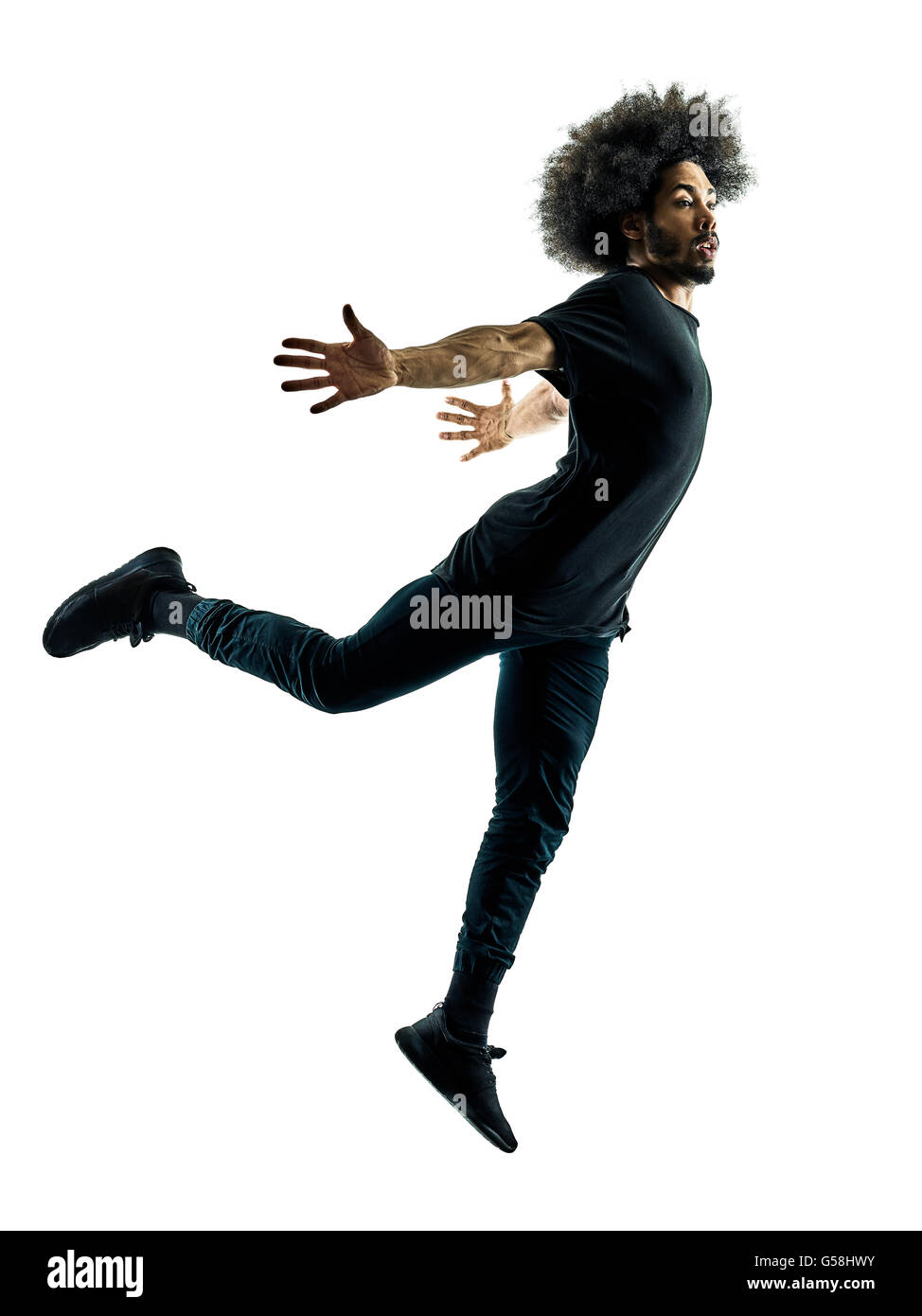 Un homme africain danseur en silhouette isolé sur fond blanc Banque D'Images