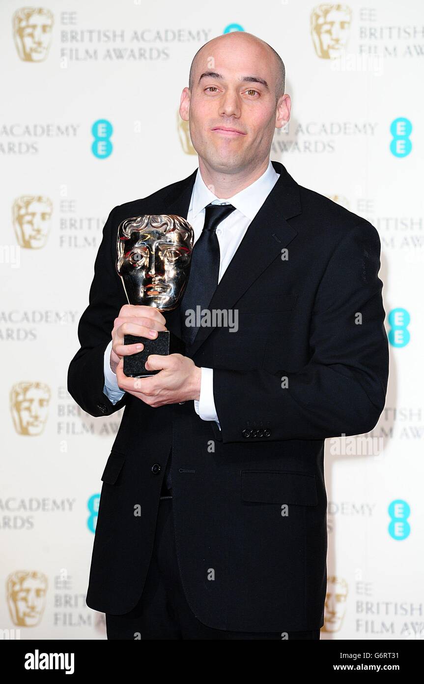 Joshua Oppenheimer a reçu le prix du meilleur documentaire pour « The Act of Killing », lors des EE British Academy film Awards 2014, au Royal Opera House, Bow Street, Londres. Banque D'Images