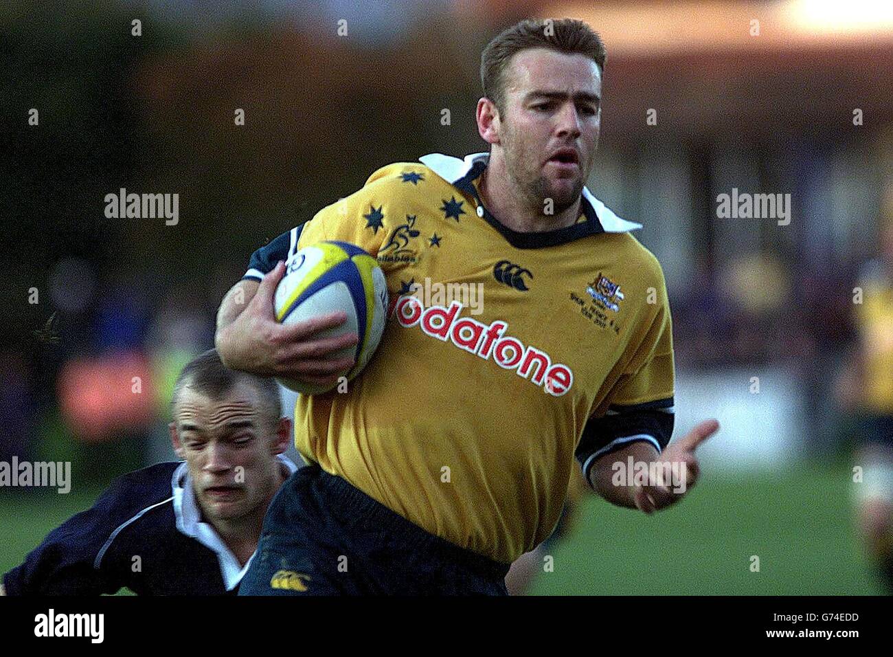 Chris Latham, de l'Australie, a réussi à marquer la première tentative lors du match Tour entre l'université d'Oxford et l'Australie à Iffley Road, Oxford. Banque D'Images