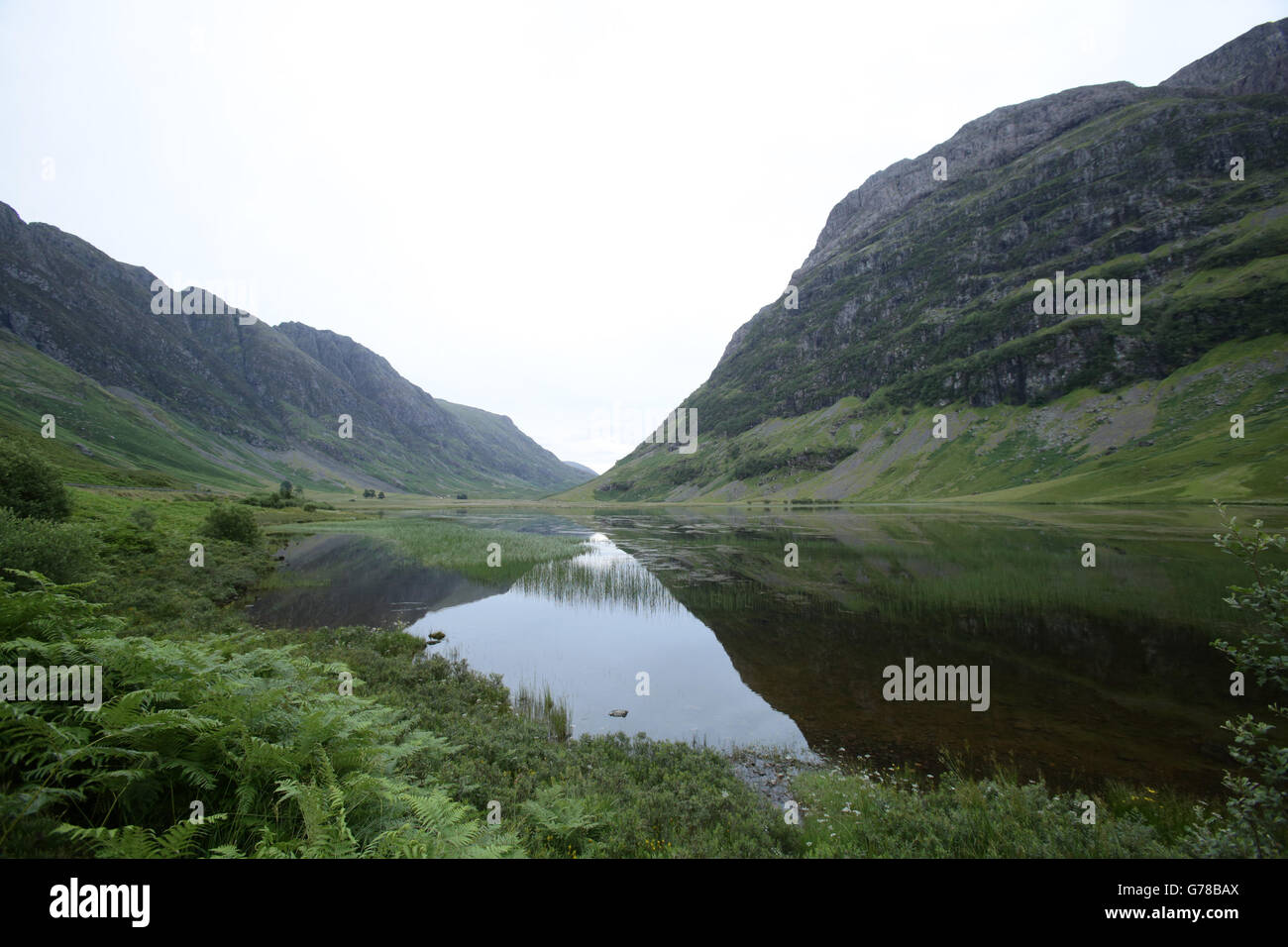 Vue sur le Loch Achtriochtan et la montagne Aonach Dubh (à droite) à Glencoe, dans les Highlands d'Écosse. APPUYEZ SUR ASSOCIATION photo. Date de la photo: Mardi 15 juillet 2014. Le crédit photo devrait se lire: Yui Mok/PA Wire Banque D'Images