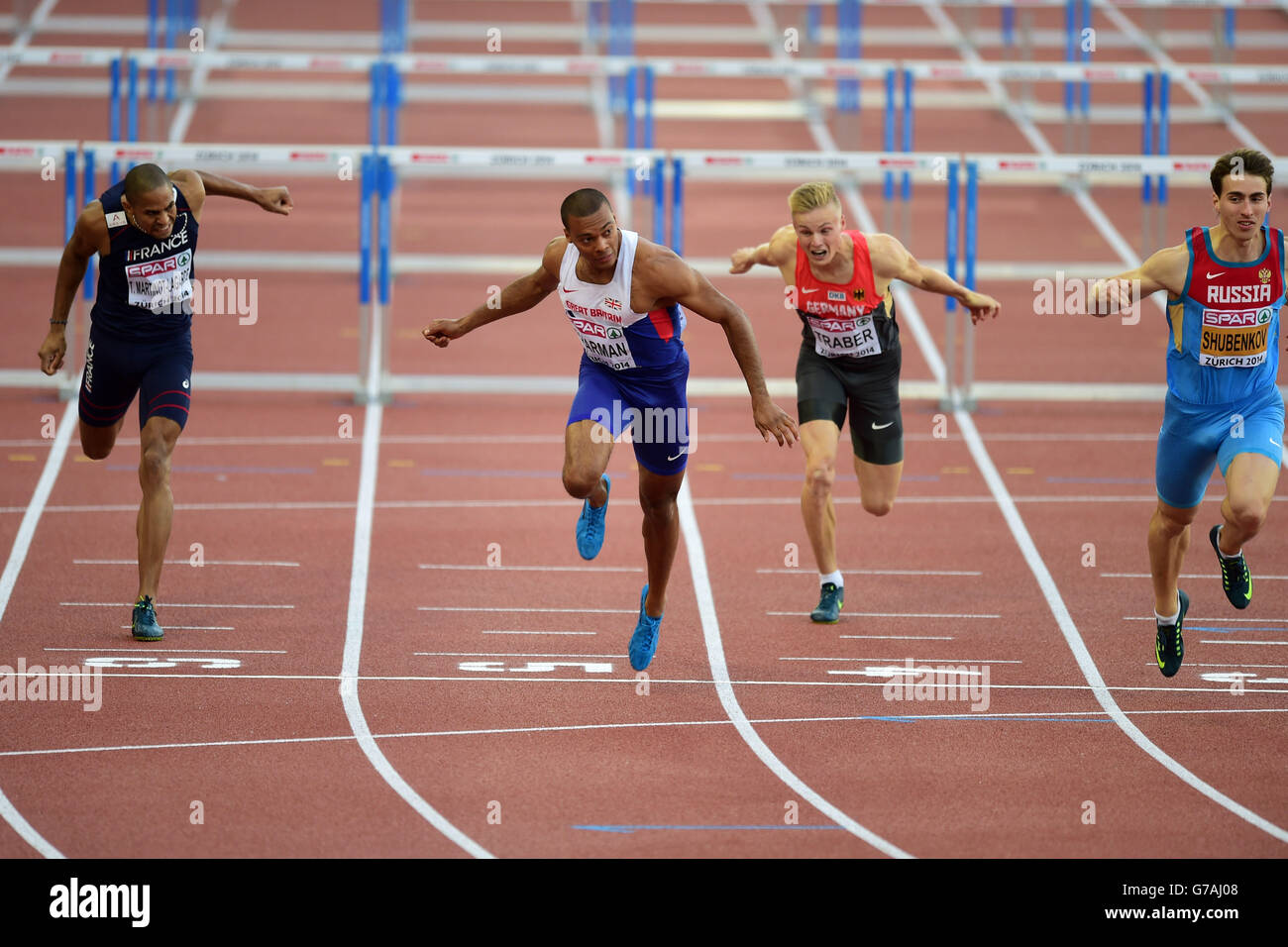 William Sharman, en Grande-Bretagne, termine premier à la demi-finale hommes de 110m haies au troisième jour des Championnats d'athlétisme européens 2014 au stade Letzigrund, à Zurich. Banque D'Images