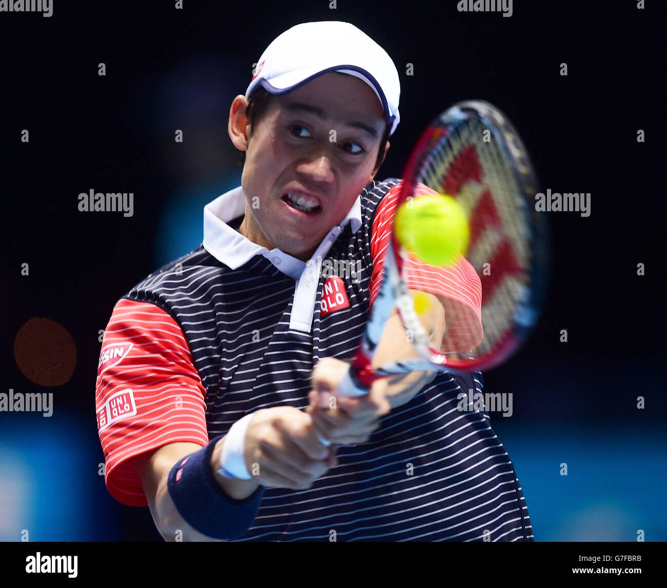 Kei Nishikori au Japon en action contre Roger Federer en Suisse lors des finales du Barclays ATP World Tour à l'O2 Arena de Londres.APPUYEZ SUR ASSOCIATION photo.Date de la photo: Mardi 11 novembre 2014.Voir PA Story TENNIS Londres.Le crédit photo doit indiquer Adam Davy/PA Wire. Banque D'Images