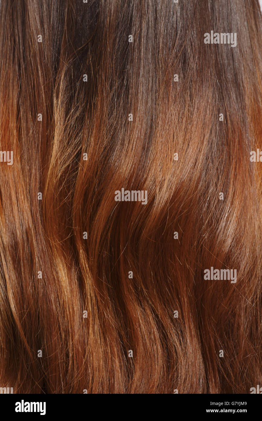Longs cheveux bruns en arrière-plan Banque D'Images