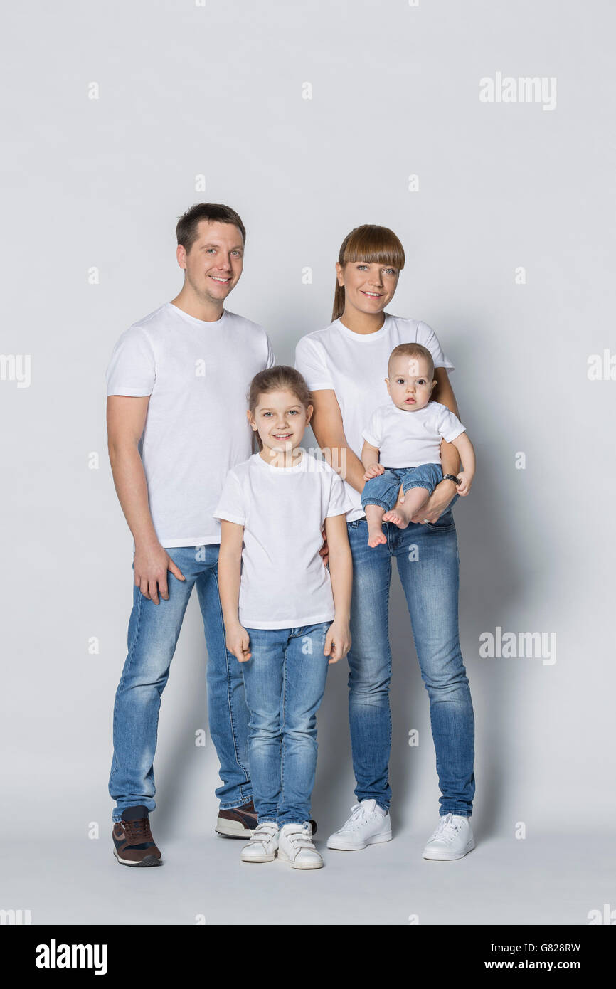 Portrait of happy family against white background Banque D'Images