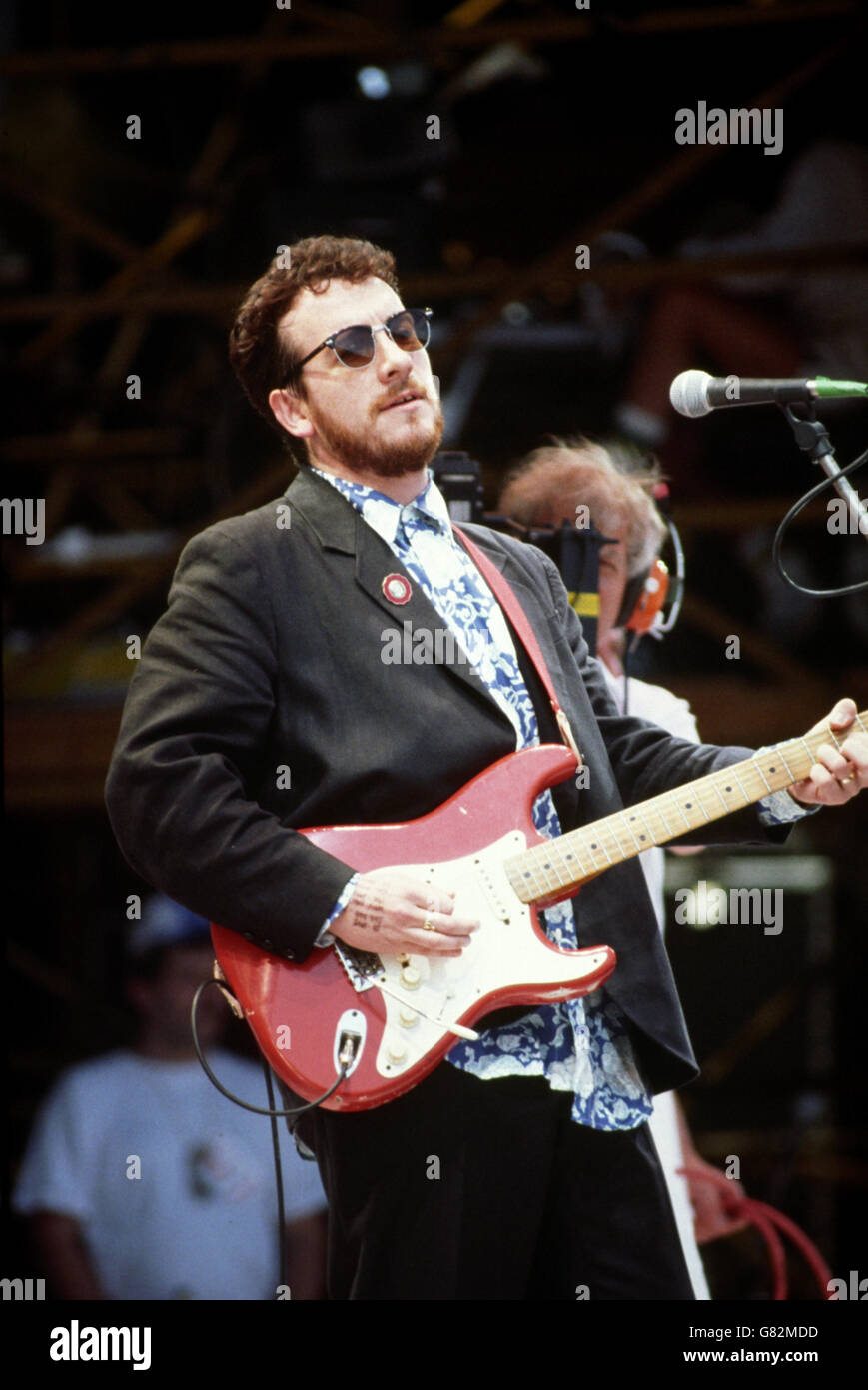 Concert d'aide en direct - Stade Wembley. Elvis Costello en scène. Banque D'Images
