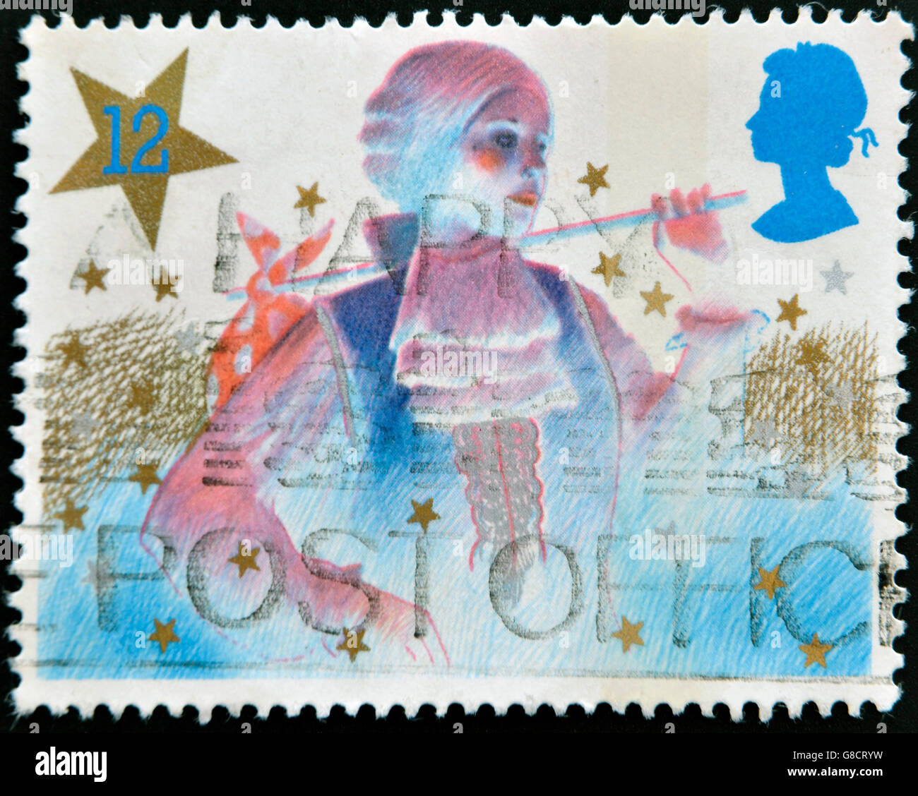 Royaume-uni - circa 1985 : timbre imprimé en Grande-Bretagne montre l'image de garçon principal dans une pantomime de Noël, vers Banque D'Images