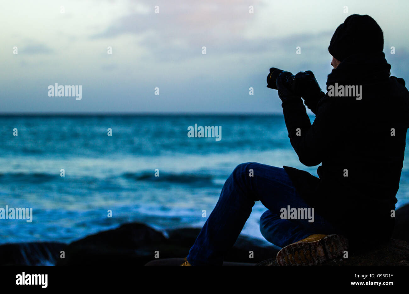 Photographe de tir avec le coucher du soleil Banque D'Images