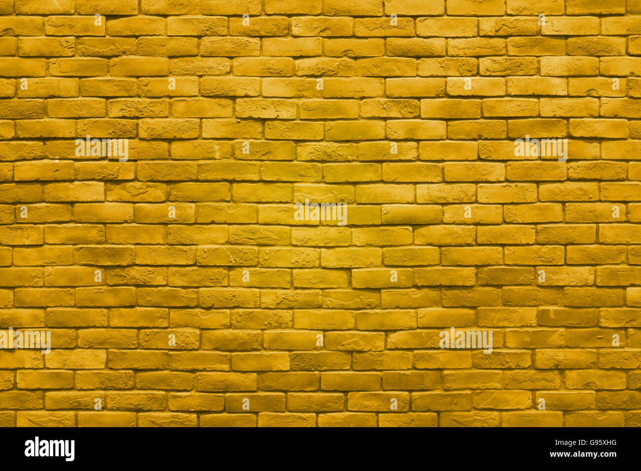 La texture du mur de brique en or jaune fond couleur. Banque D'Images