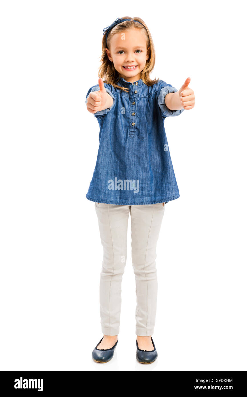 Studio Portrait of a cute blonde girl with Thumbs up, isolé en blanc Banque D'Images