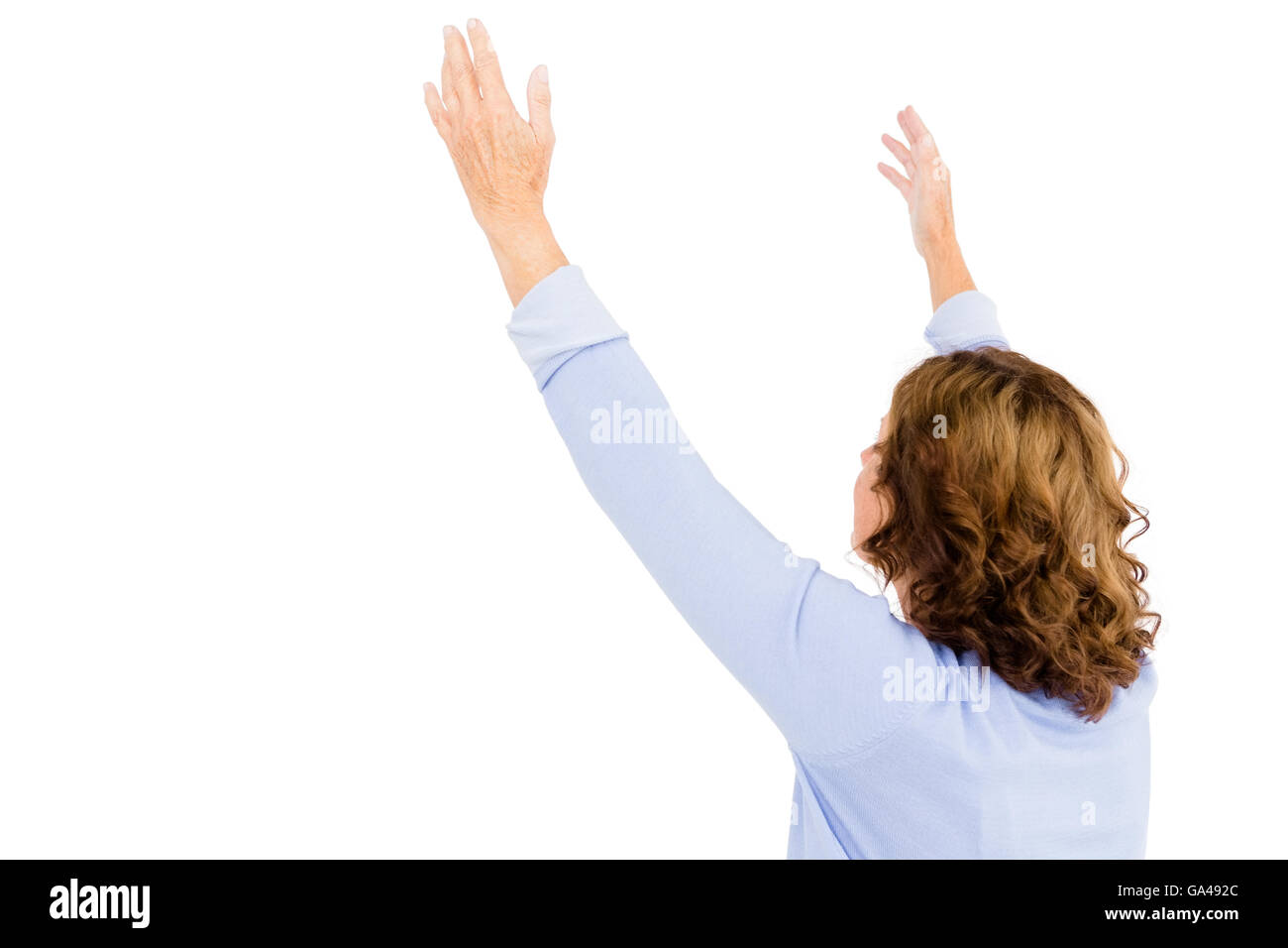 Woman soulevées pendant la prière Banque D'Images