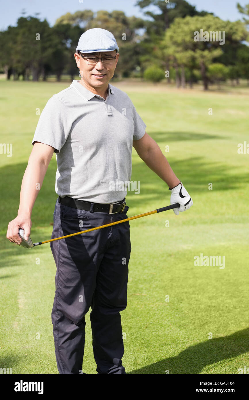 Portrait de golfeur tenant son golf club Banque D'Images
