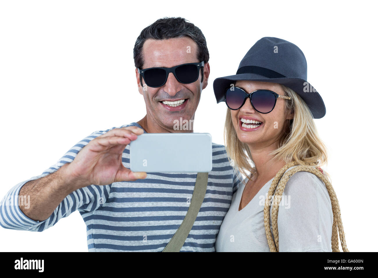 Young couple smiling selfies tout en tenant Banque D'Images