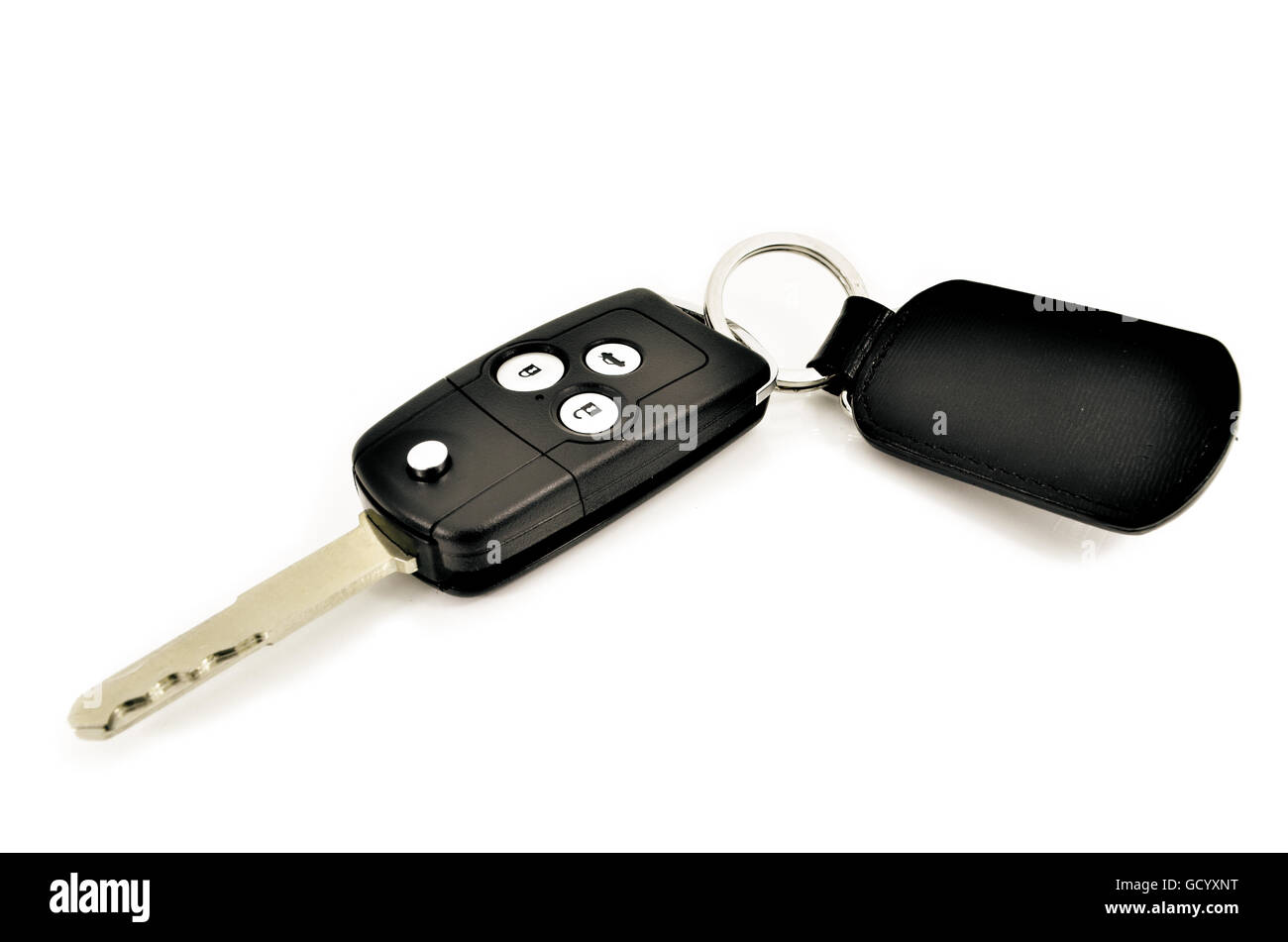 Clé de voiture avec télécommande sans fil et en cuir tag sur fond blanc Banque D'Images