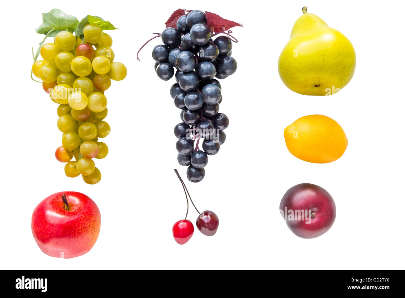 Fruits et légumes isolées en plastique sur un fond blanc Banque D'Images