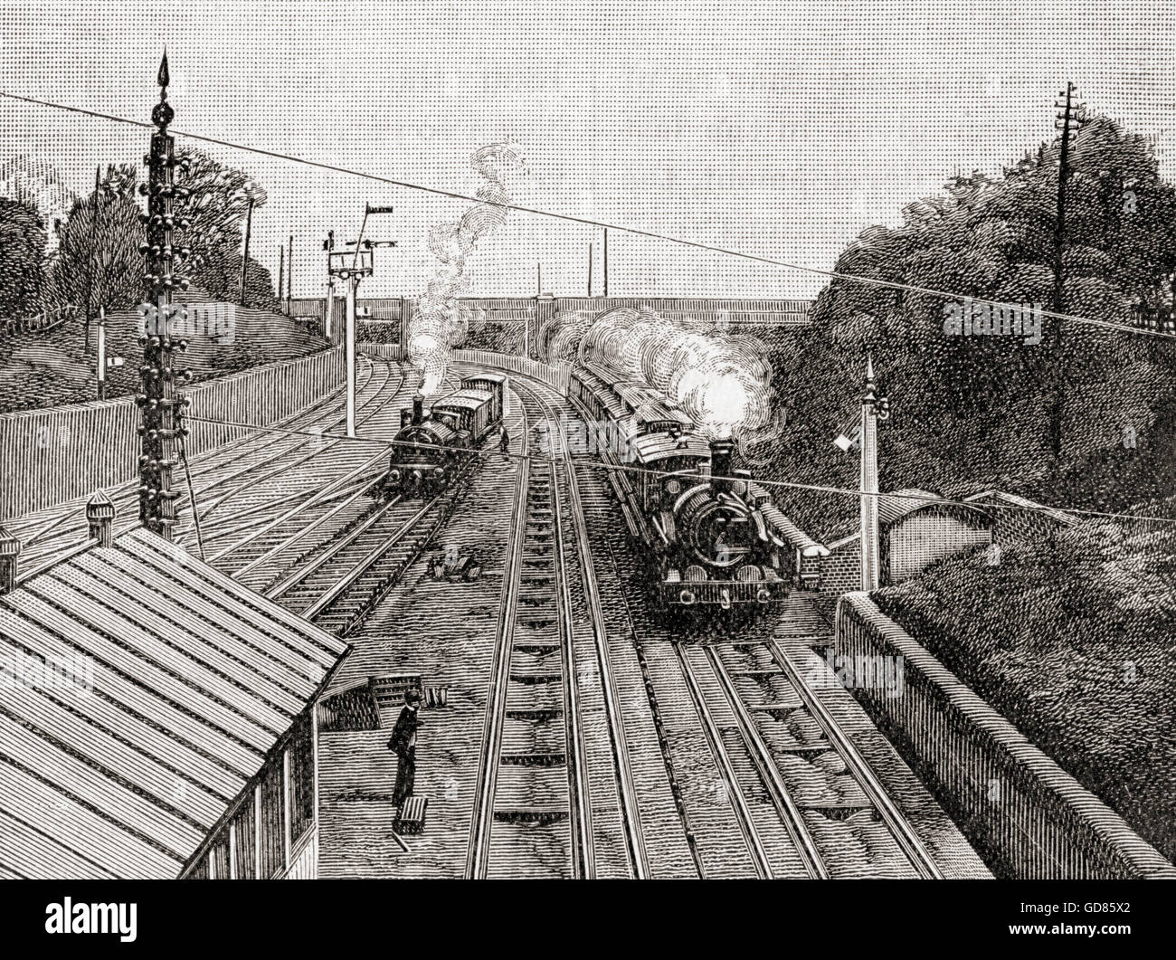 Le hollandais volant, à droite, en passant devant la gare d'Acton, Londres, Angleterre sur la Great Western Railway à soixante milles à l'heure au 19e siècle. La Great Western Railway exploité sur un double système de jauge à l'aide d'une jauge large de 7 pieds (jusqu'à 1892) et d'un calibre de 4 ft 8 1⁄2 in. Banque D'Images