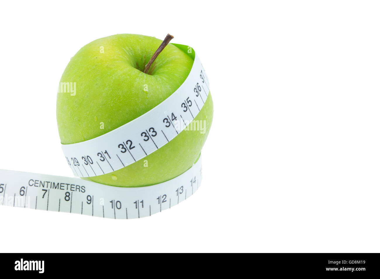 La pomme verte mesurer autour de la taille isolé sur fond blanc Banque D'Images