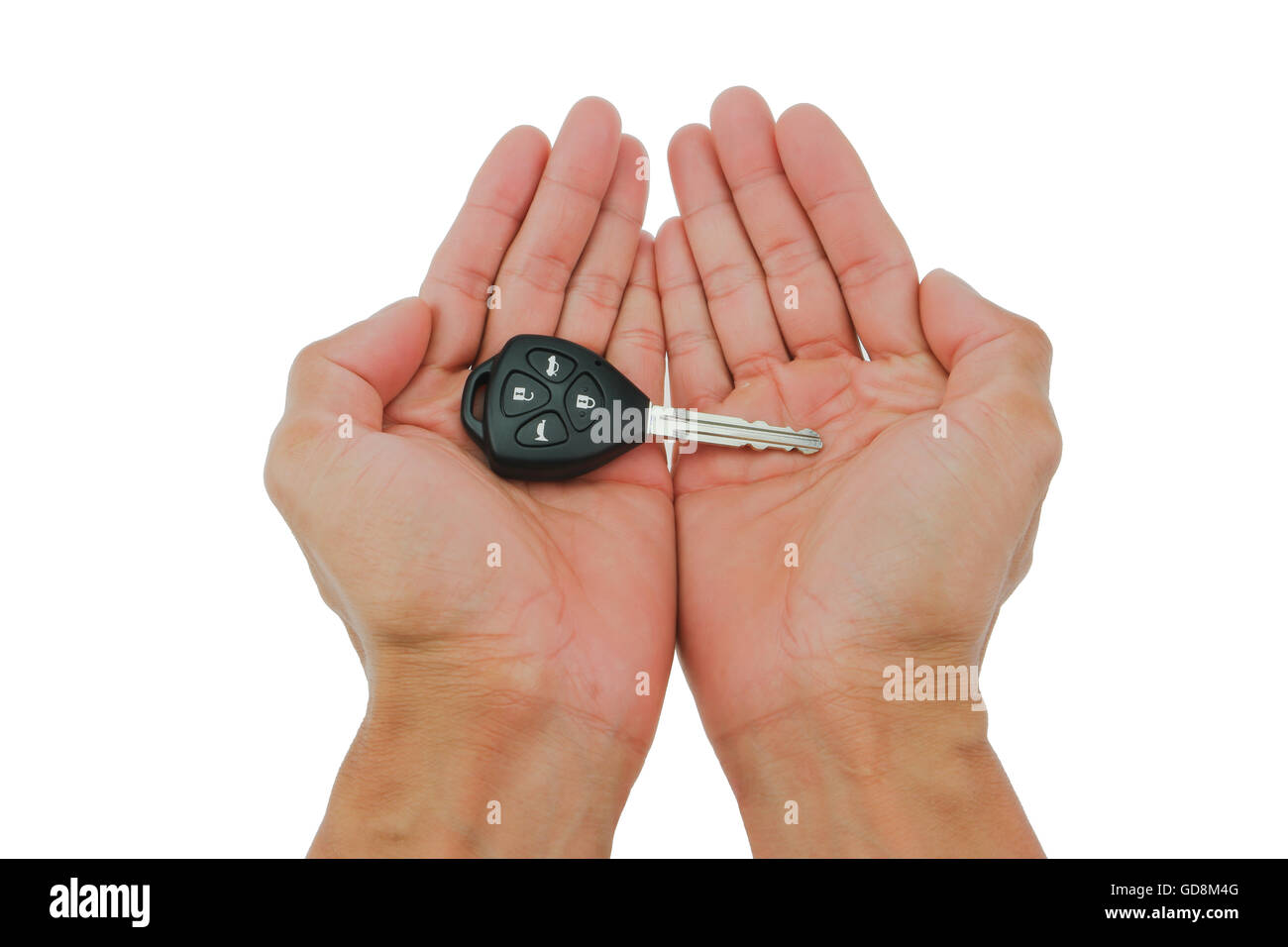 Les clés de voiture à la main sur isoler fond blanc Banque D'Images