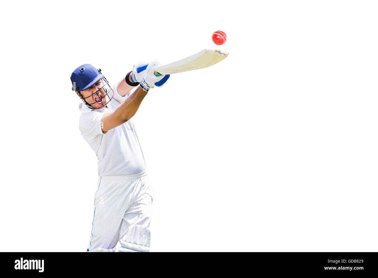 Un jeune homme indien cricketer hitting ball jeu de sport de cricket Banque D'Images