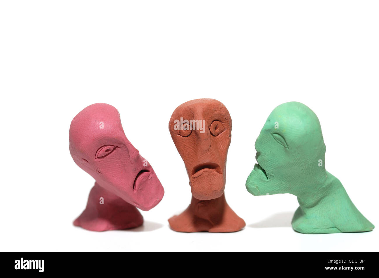 Les hommes avec faces en plasticine laid Banque D'Images