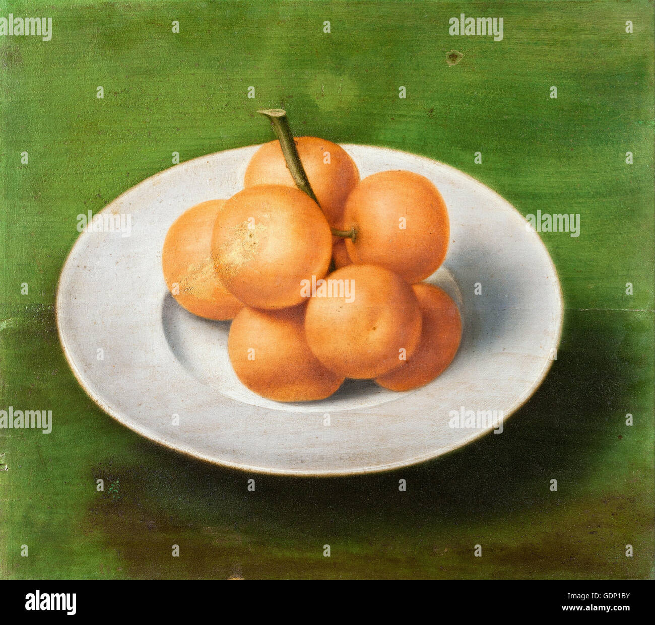 Nature morte avec oranges sur une plaque Banque D'Images