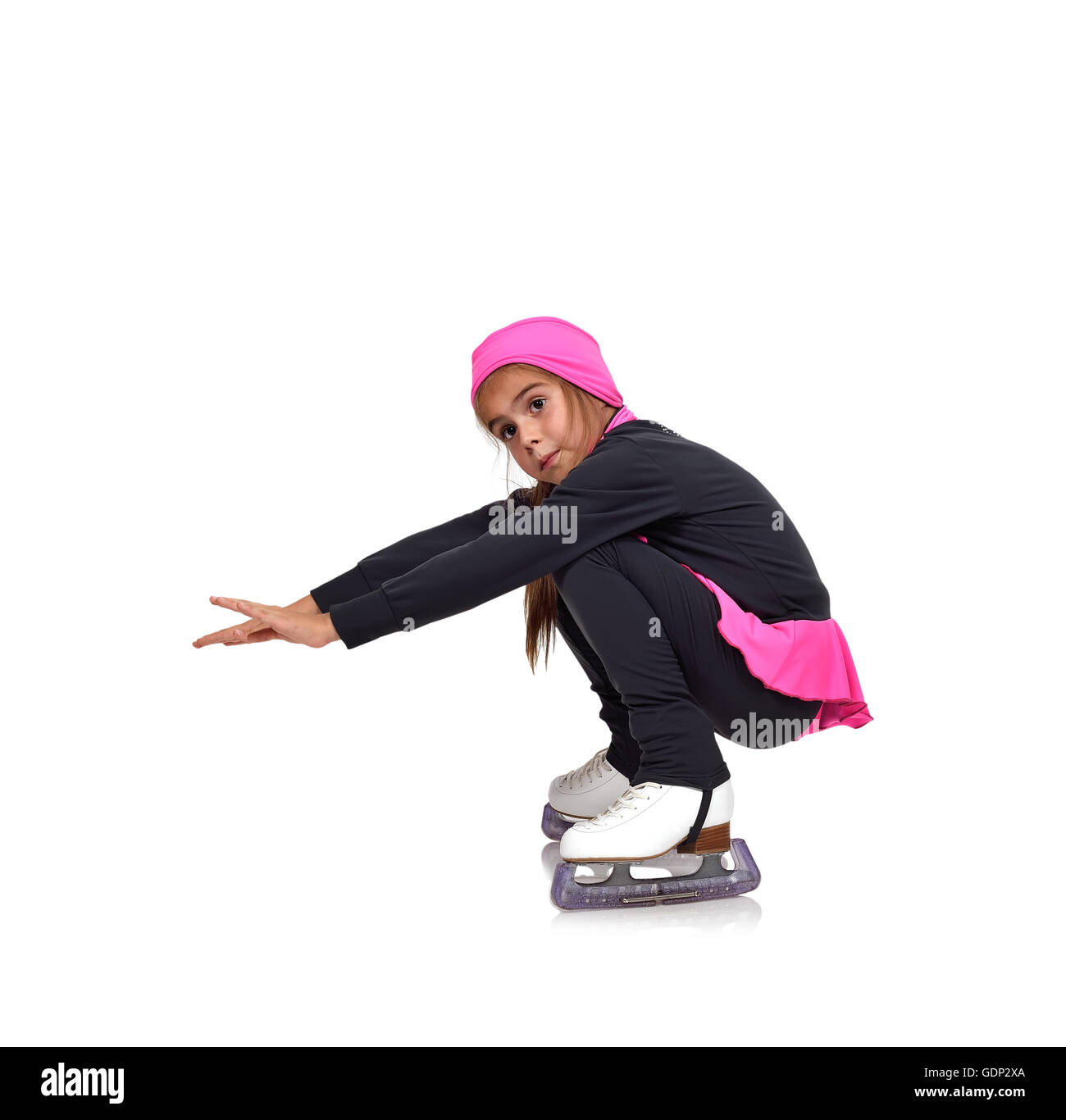 Petite fille figure skating sur fond blanc Banque D'Images