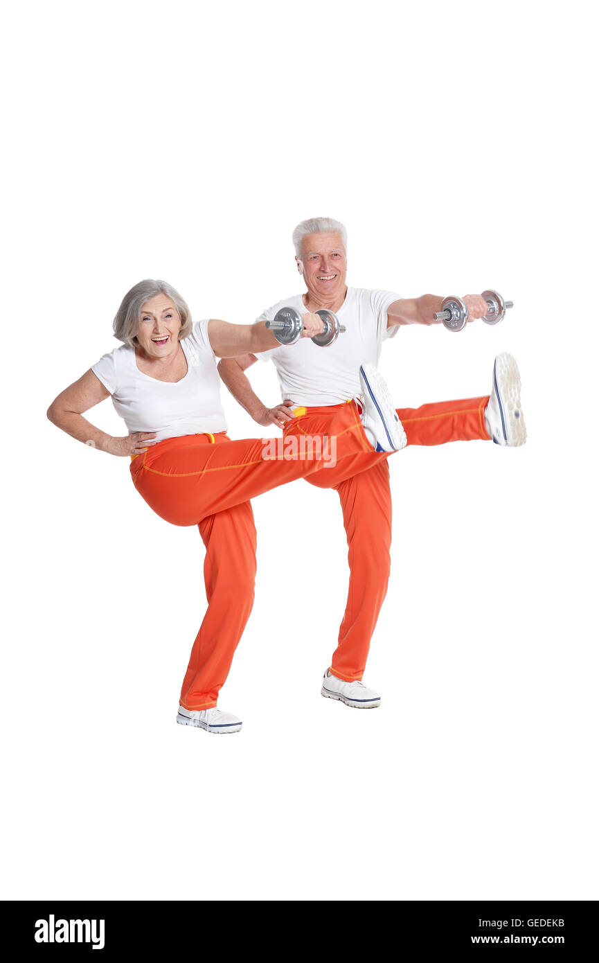 Senior Couple Exercising with dumbbells Banque D'Images