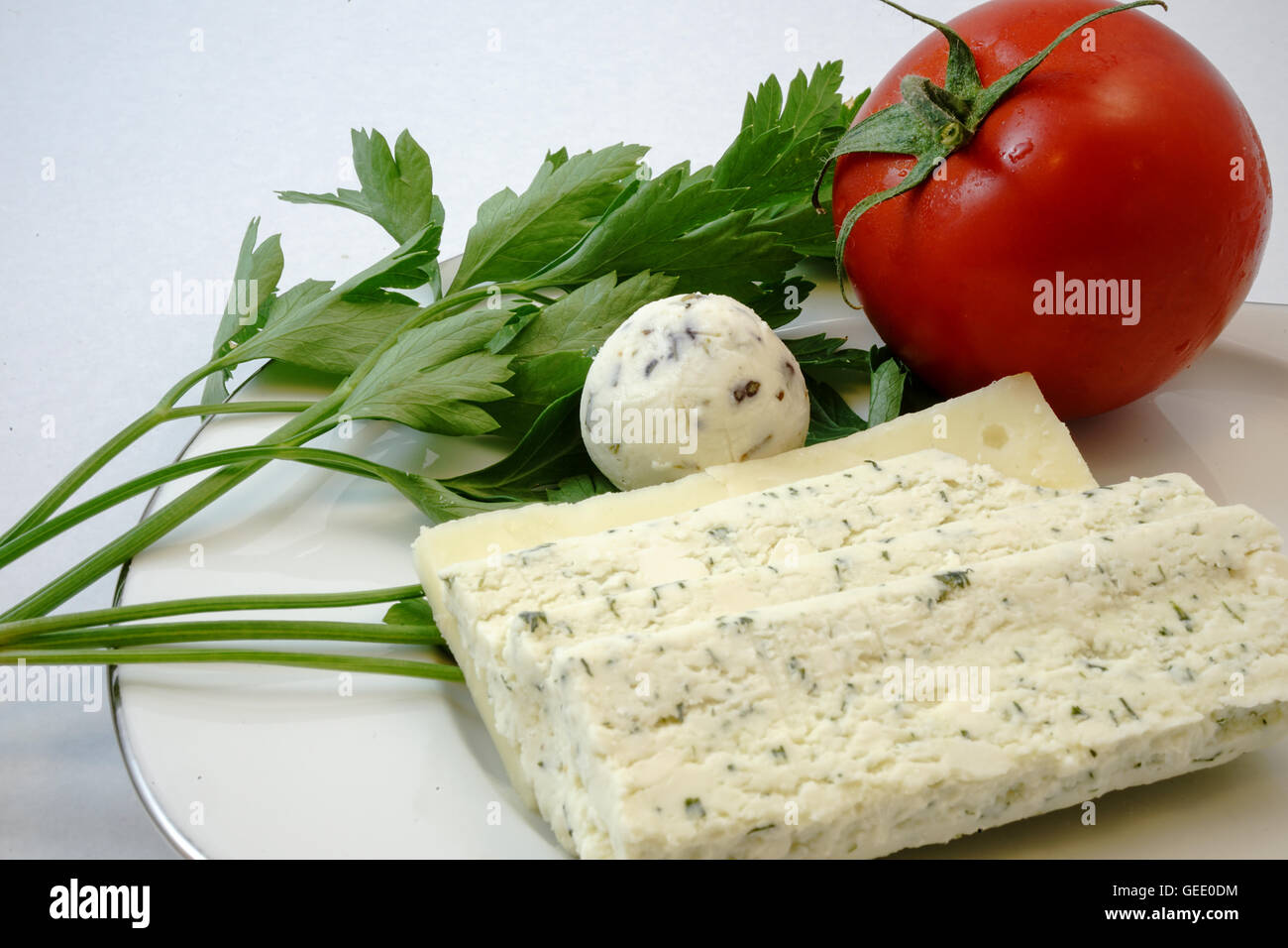 Le fromage et le persil et la tomate Banque D'Images