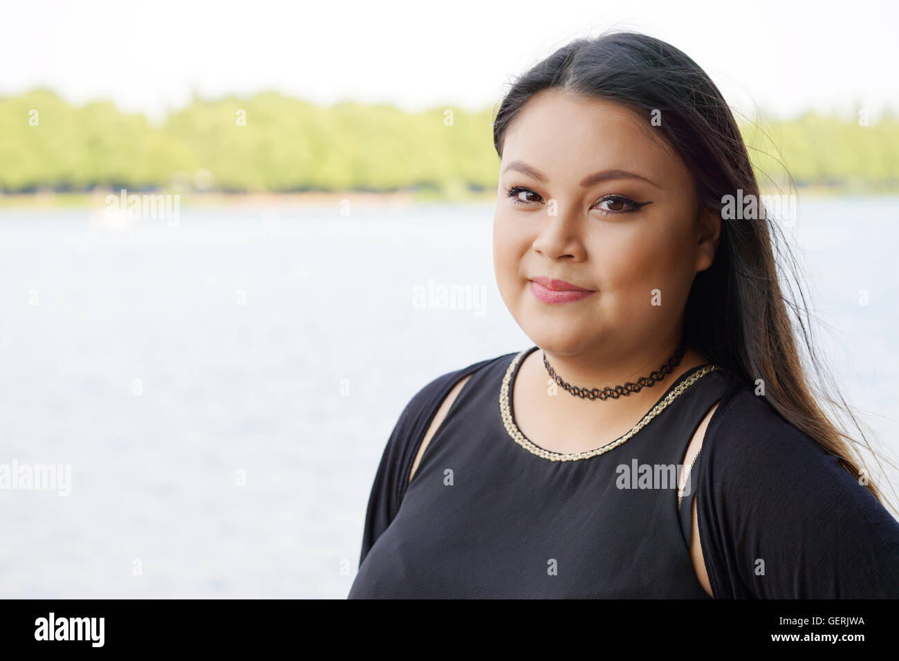 Smiling young asian woman Banque D'Images