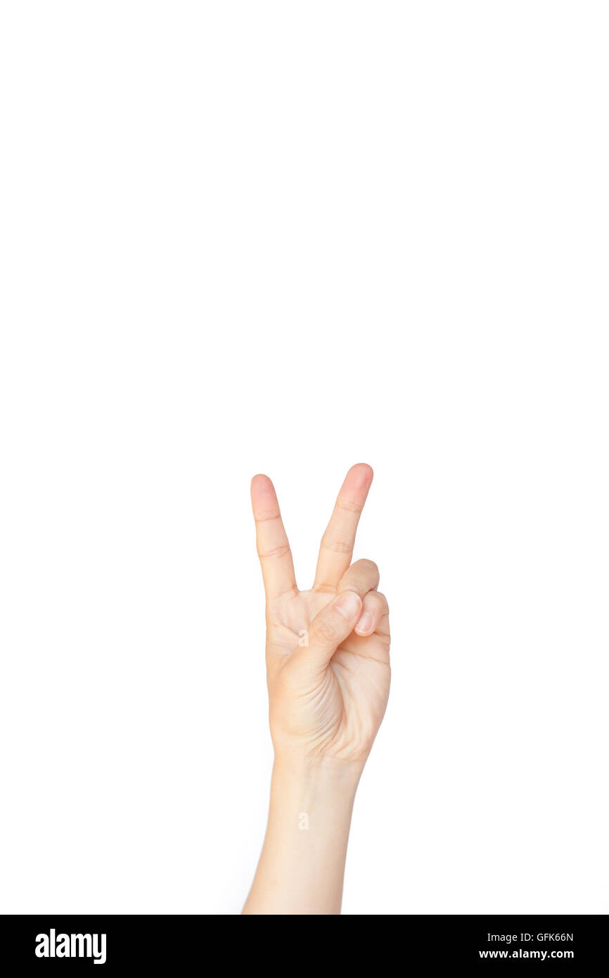 Geste : main japonais numéro deux, la paix sur fond isolé blanc Banque D'Images