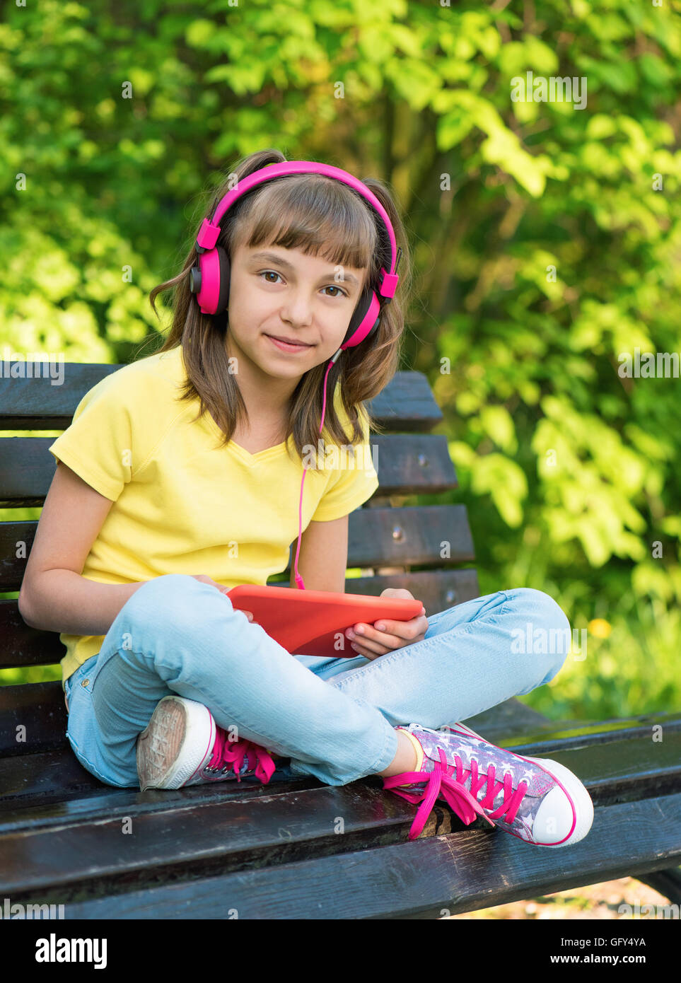 Girl with tablet Banque D'Images